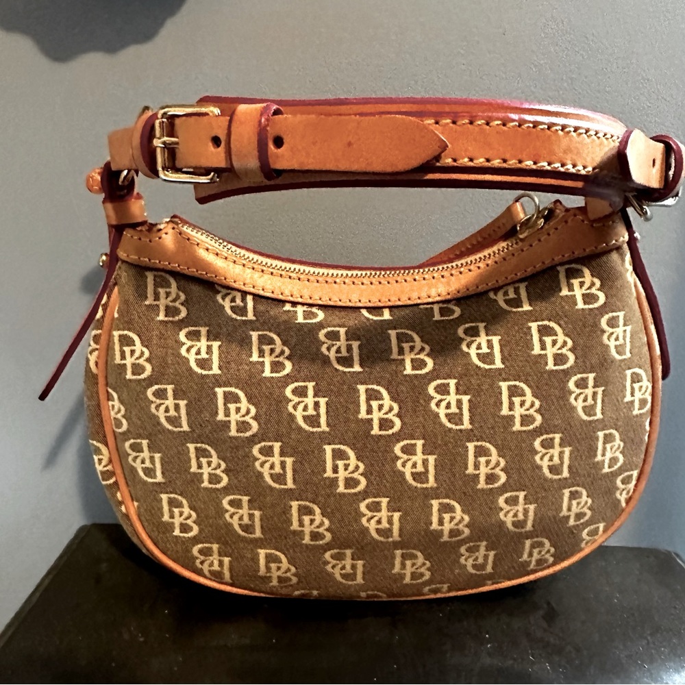Authentic Dooney & Bourke Mini Hobo bag. Tan/brown in color with monogrammed